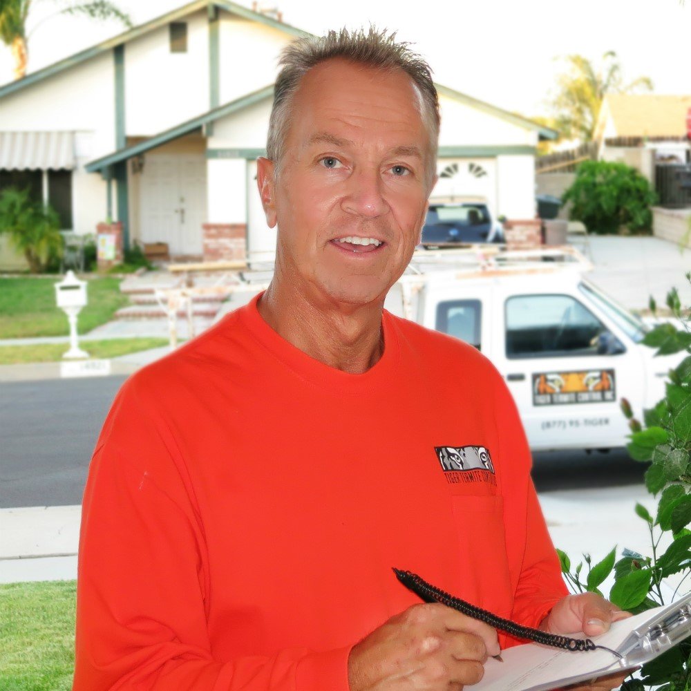 Pest control technician with clipboard.